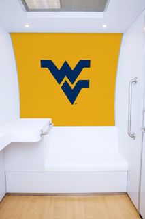WVU’s nursing pod interior with flying wv logo on the wall
